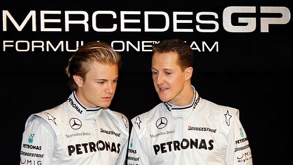 Nico Rosberg and Michael Schumacher show off their new racing colours together at the Mercedes-Benz Museum in Stuttgart.