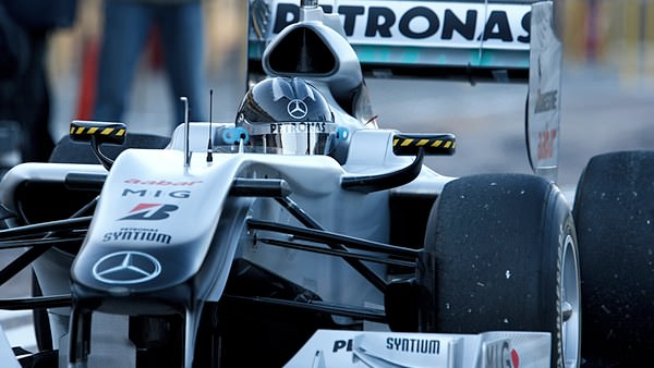 Michael Schumacher wears a new black helmet testing the Mercedes in Valencia.
