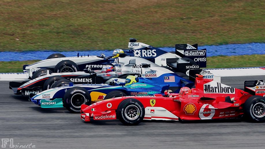 Four drivers battle for position in Malaysia 2005