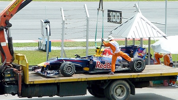 Red Bull catch a lift back to the pitlane.