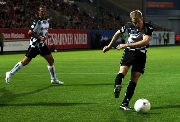 Motorsport and football exist in perfect harmony as F1 stars Sebastian Vettel and Michael Schumacher take to the pitch.