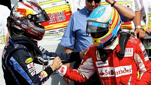 Vettel congratulates Alonso on his win in Germany.