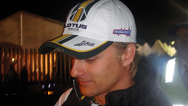 Heikki Kovalainen signs autographs after qualifying on Saturday