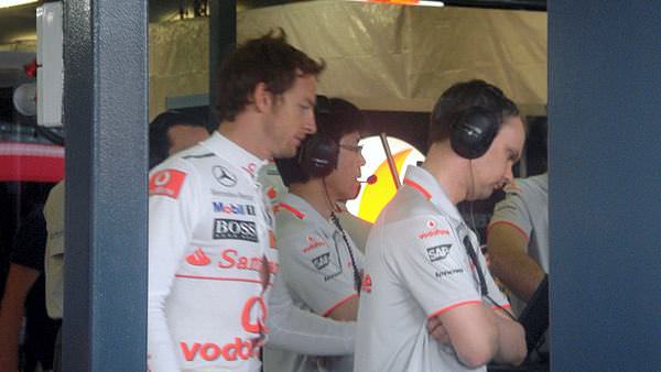 Jenson Button arrives in the garage to prepare for Free Practice 2