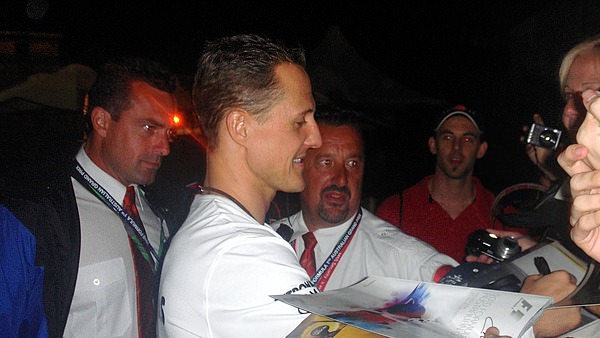 Michael Schumacher surprises the fans by signing, chatting and posing