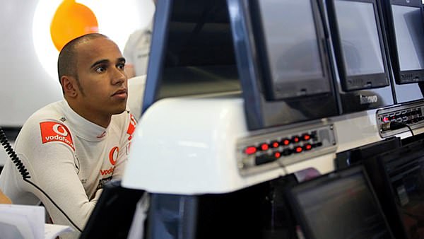 Lewis Hamilton spends some time studying the data