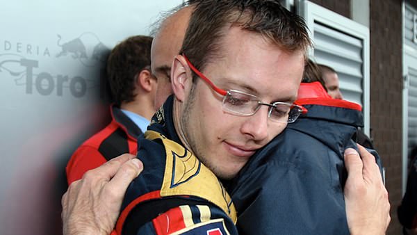 Bourdais gets a well needed hug from his boss after a fraught Belgian Grand Prix in 2008