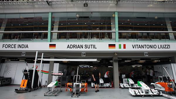 The Force India garages during a calm pit lane moment ahead of the Singapore Grand Prix weekend