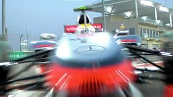 Lewis Hamilton interfaces with an Abu Dhabi bollard
