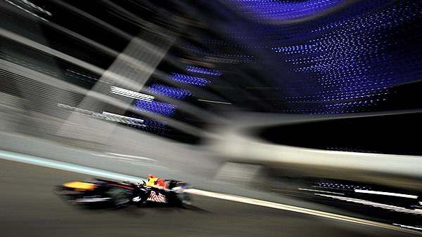 Sebastian Vettel streaks around the Yas Marina circuit to take pole position
