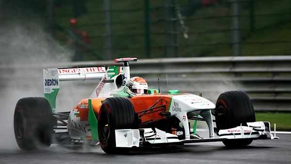 Michael Schumacher and Mark Webber lead damp Belgian Free Practice