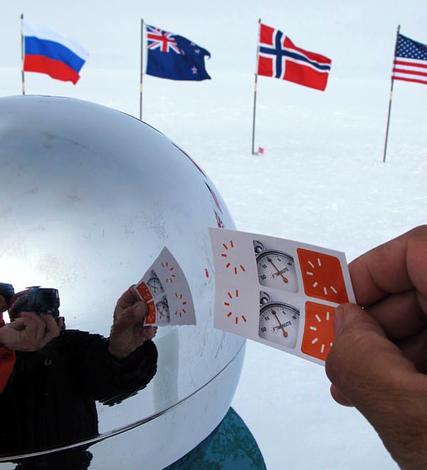 Flags of the Antarctic Treaty nations surround the sphere