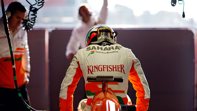 Paul di Resta climbs into his Force India F1 car