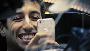 Ricciardo checks his phone in the Red Bull
