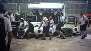 WIlliams' cars return to the pits